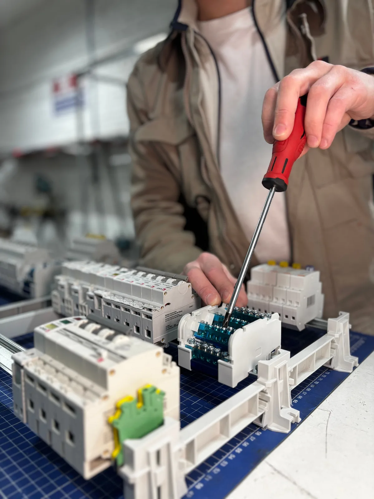 Breakers assembled on a DIN rail before installation, for ev charger installation in Winnipeg