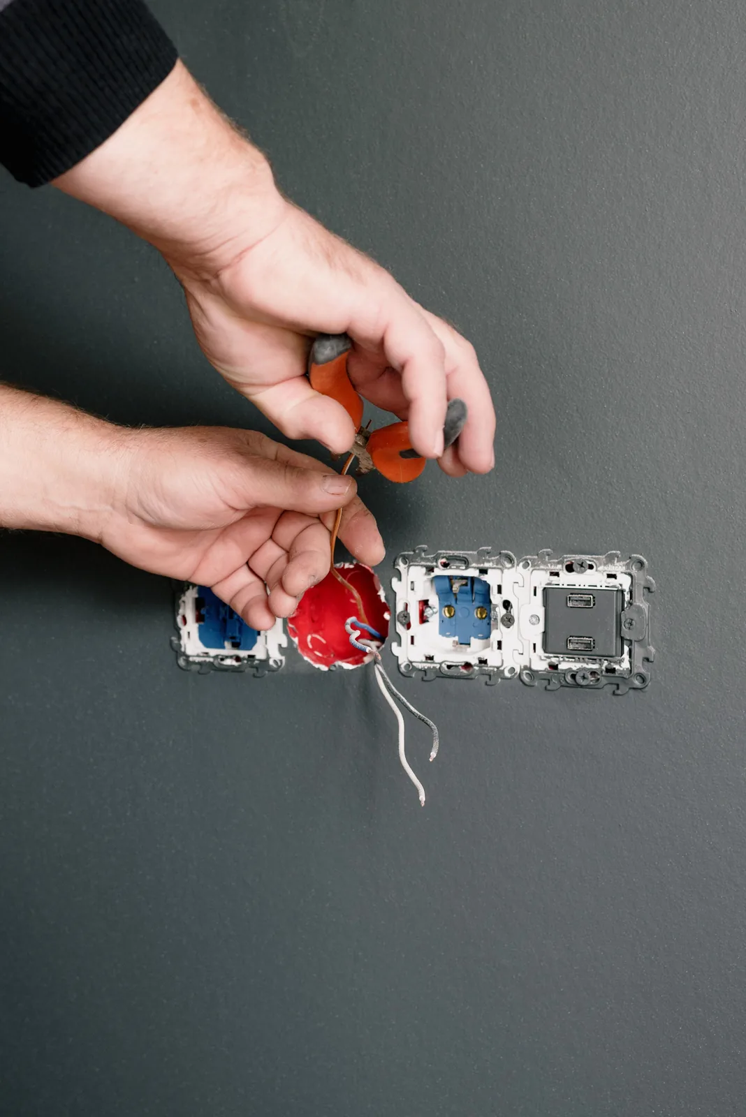 Stripping conductors at an outlet box, for light fixture repair in Winnipeg