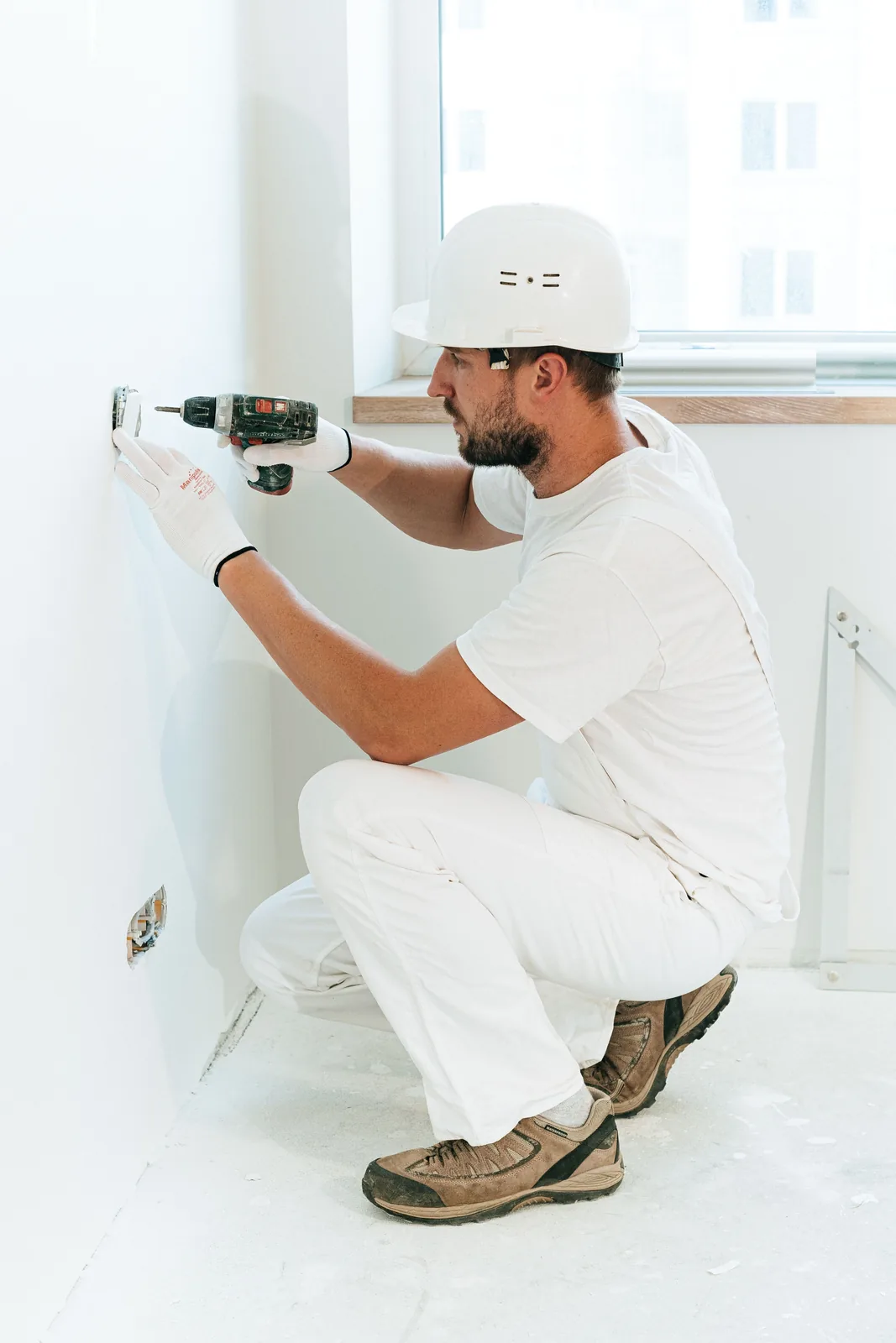 Fixing a socket into a finished wall, for electrician in Winnipeg